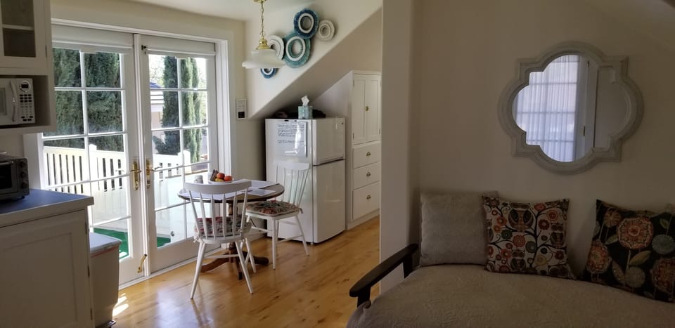 view of dining nook and deck doors from sitting area