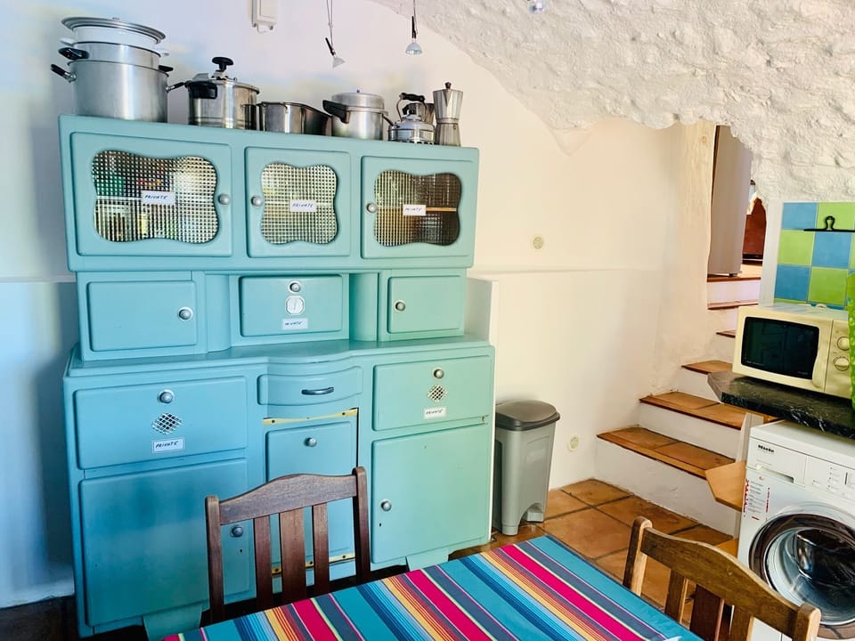 Pantry with a washing machine, tumble dryer, double sink, doors to terrace