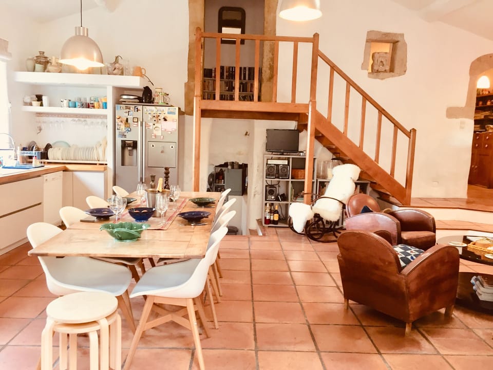 Kitchen has an American ice making fridge, double sink, dish washer, UK TV. 