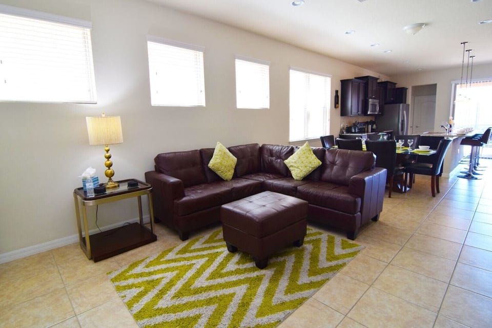 First of two lounge areas with sofas and flat screen TV