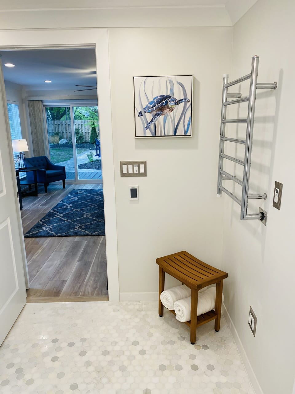 Primary Bathroom with heated marble floor and towel warmer