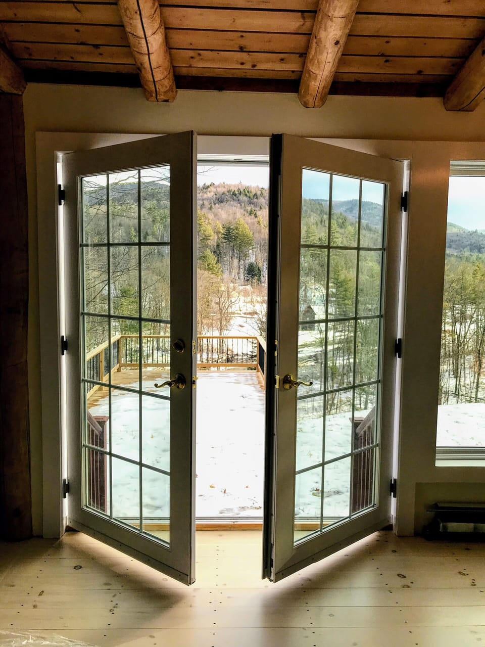French doors to back yard and deck.