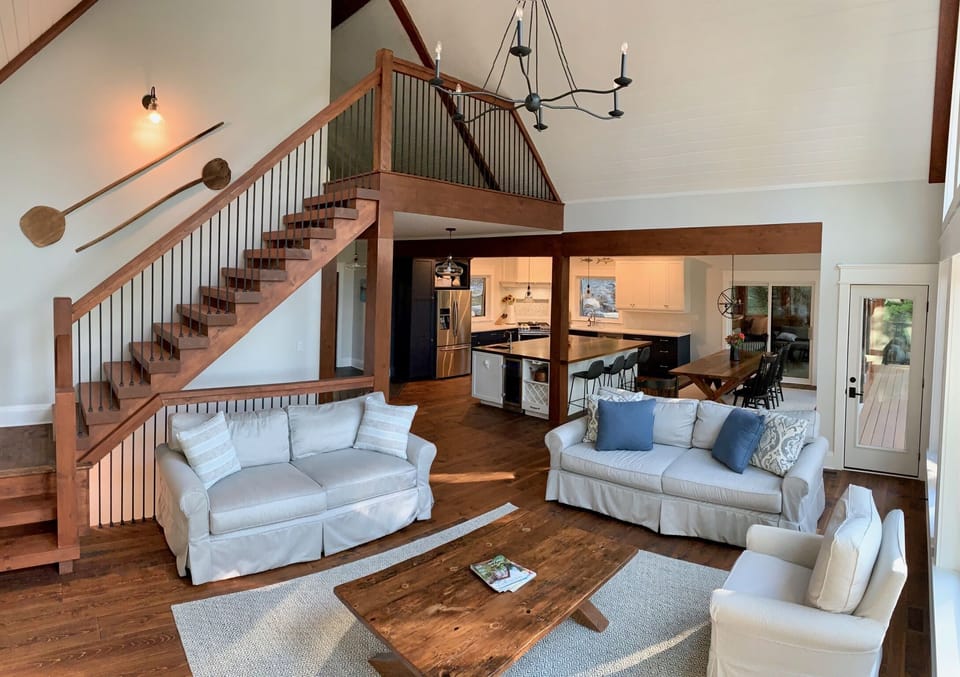 stairs lead up to loft with queen bed and half bath