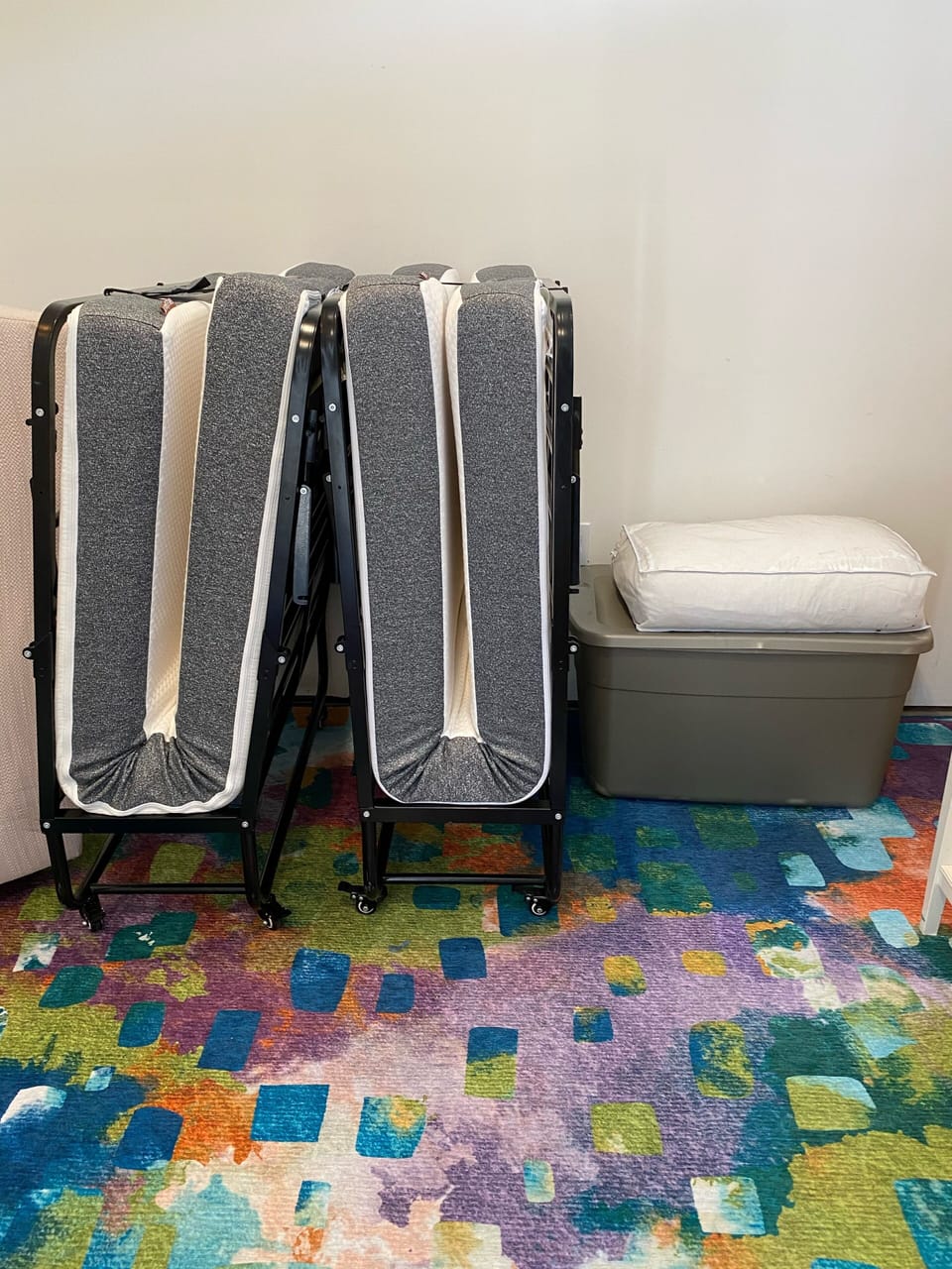 Roll away 5” mattresses with container of pillows, linens, blankets 