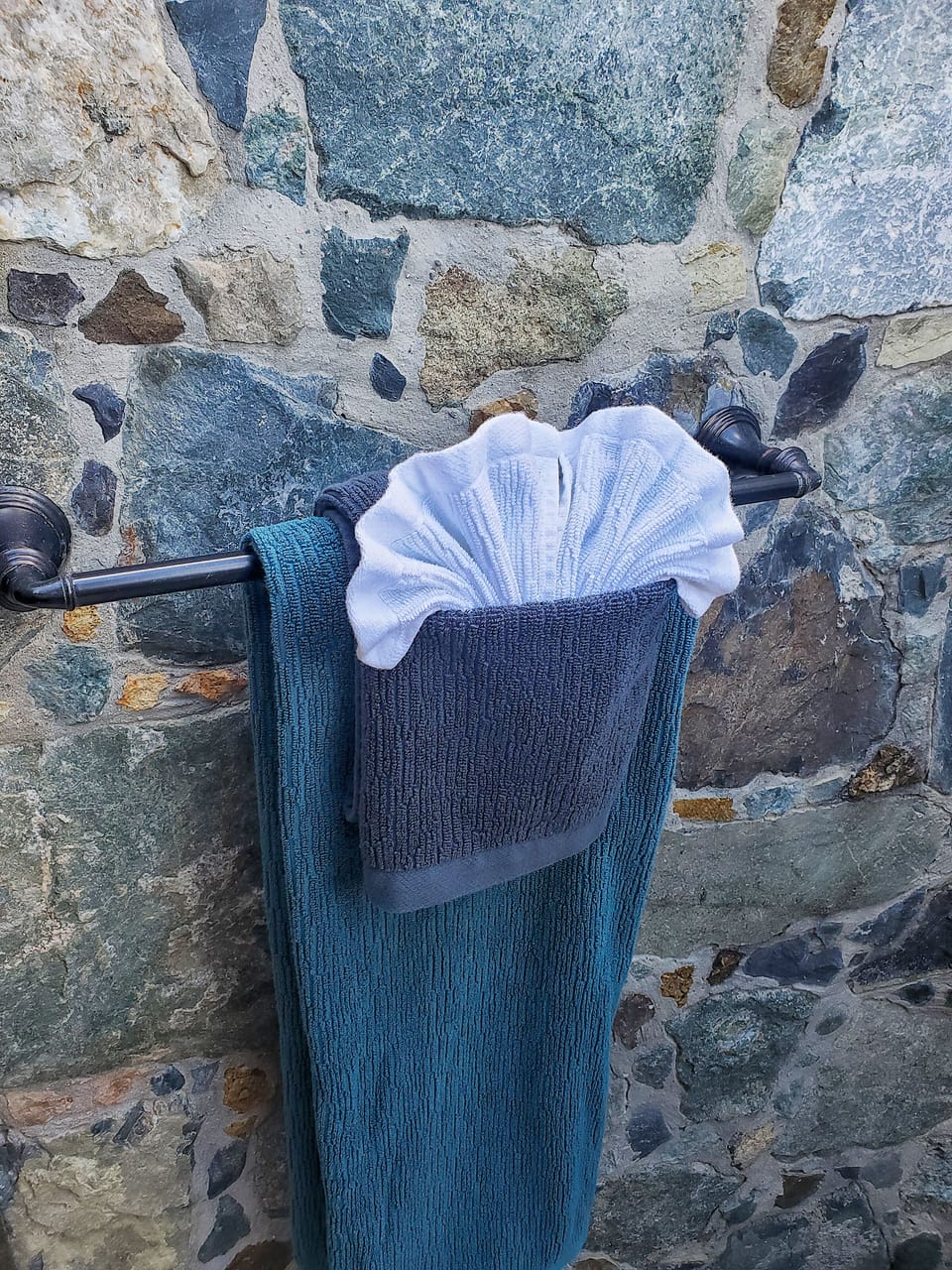 Al fresco outdoor shower belongs to the upstairs master suite!