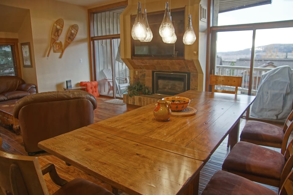The dining area adjoins the living room and deck
