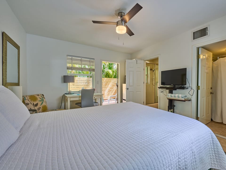 Bedroom north view with open door to patio/bathroom/walk in closet
