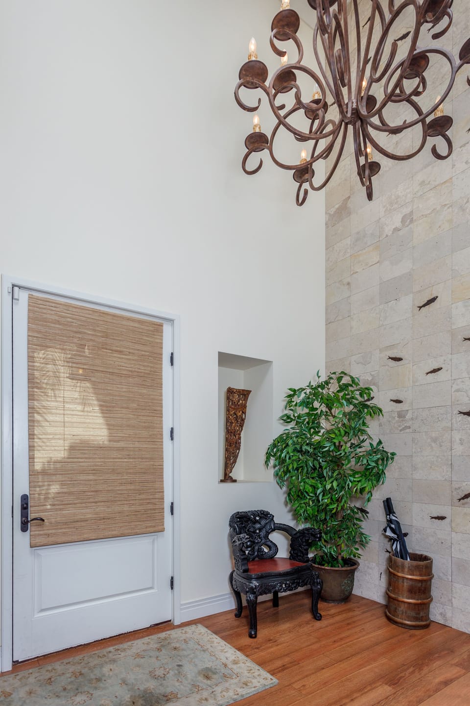 The foyer connects the bedrooms and stairs to the upper level