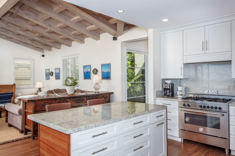 A marble-topped island adds extra space for meal prep