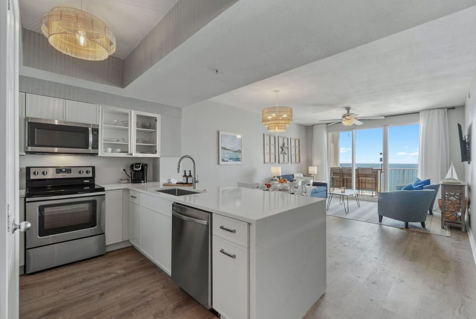 Updated kitchen with quartz counters & new fridge—style meets convenience.