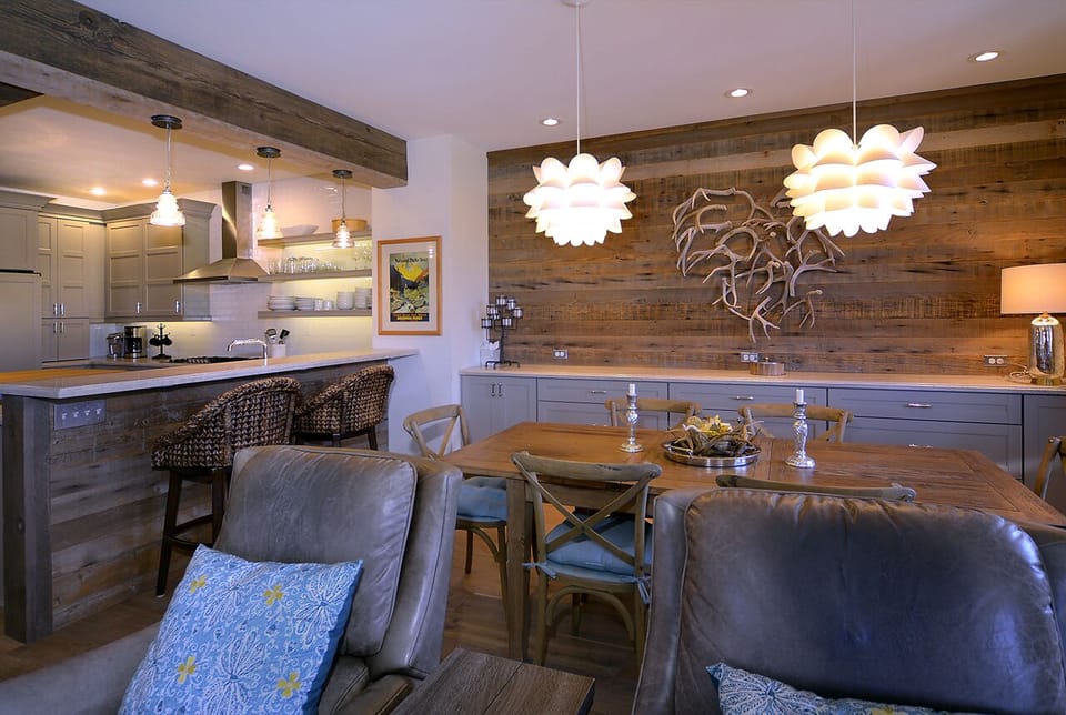 Kitchen with bar opens to dining room.
