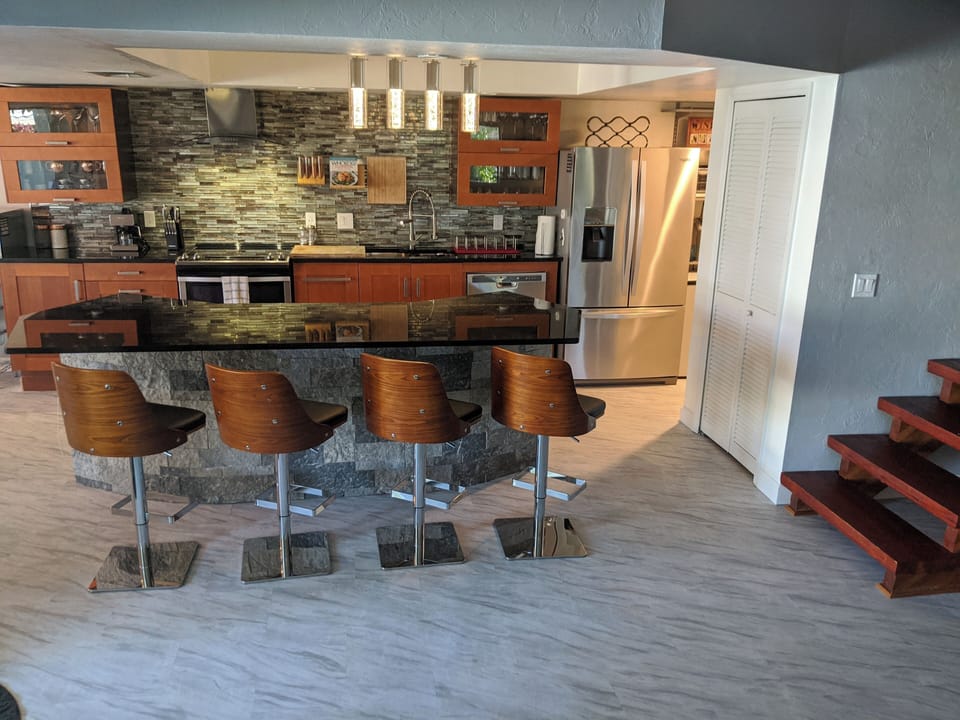 Kitchen island, guest bathroom to your right. 