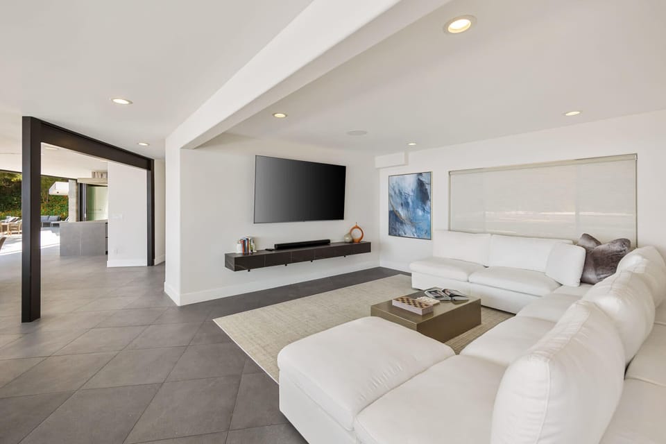 Natural light floods the room, illuminating the coastal-inspired décor.