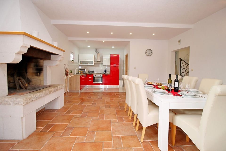 Dinning and living area with fully equipped kitchen and access to the pool