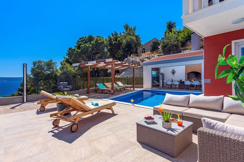 Private pool and pool area connected with summer kitchen