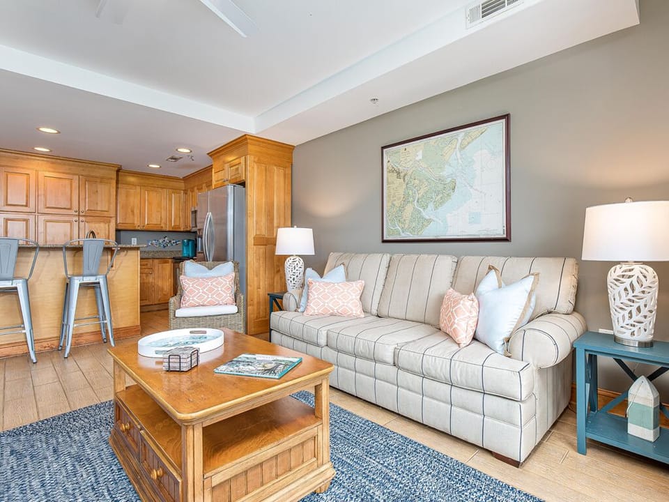 Living area with balcony access and flat-screen TV