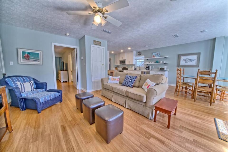 Open-concept living meets cozy charm in this inviting space, perfect for unwinding or enjoying meals with loved ones