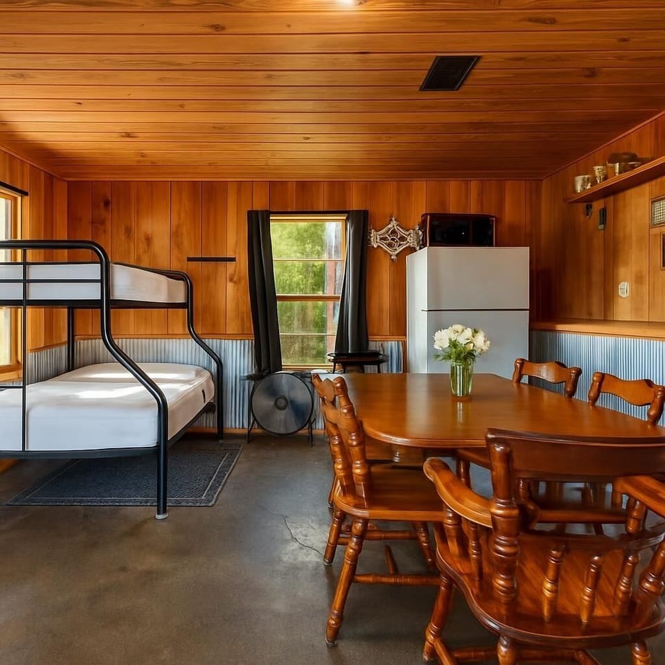 Downstairs with extra frdige, dining table and 2 sets of bunk beds