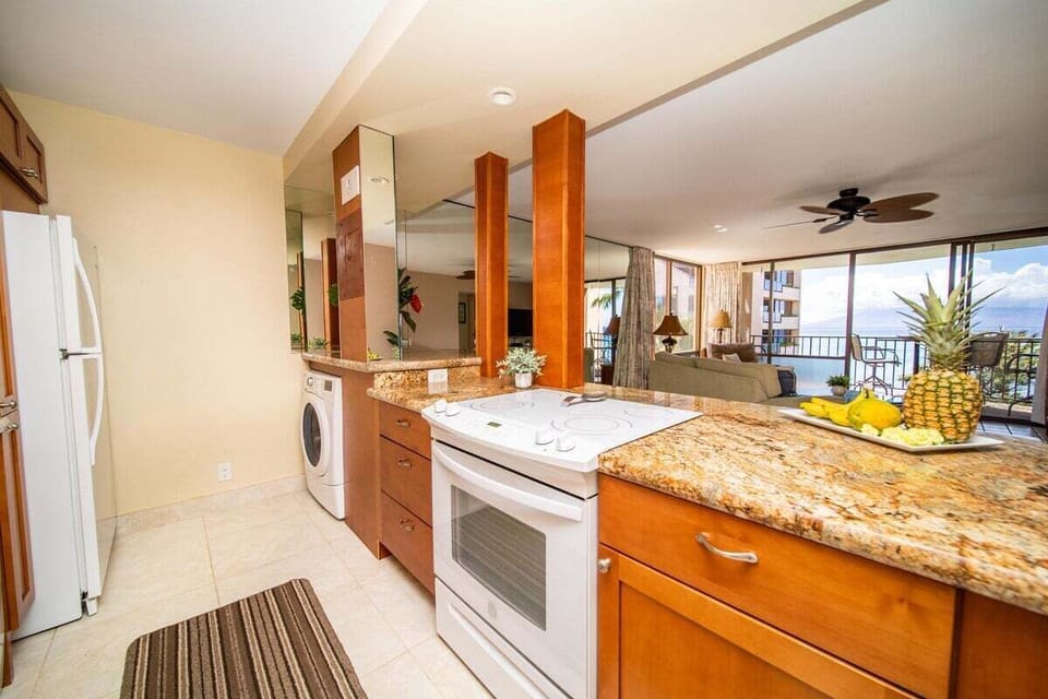 Cook in kitchens framed by granite, wood, and island light.