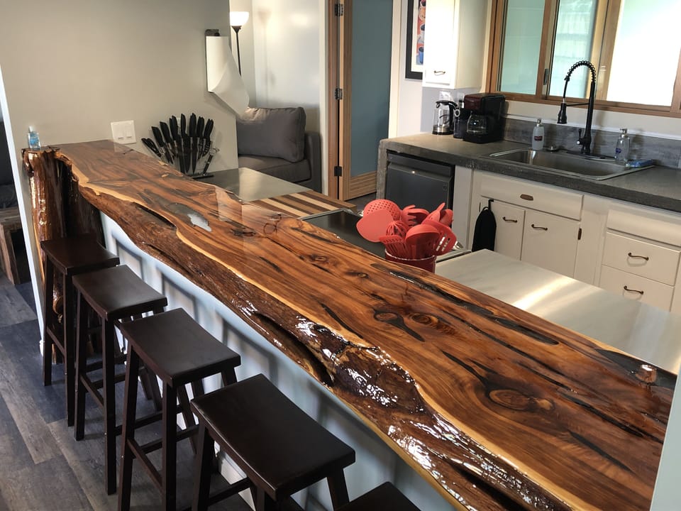 Hand carved wood bar 
Full kitchen
