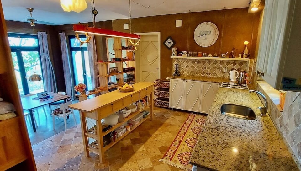 The kitchen and view to inside dining area.