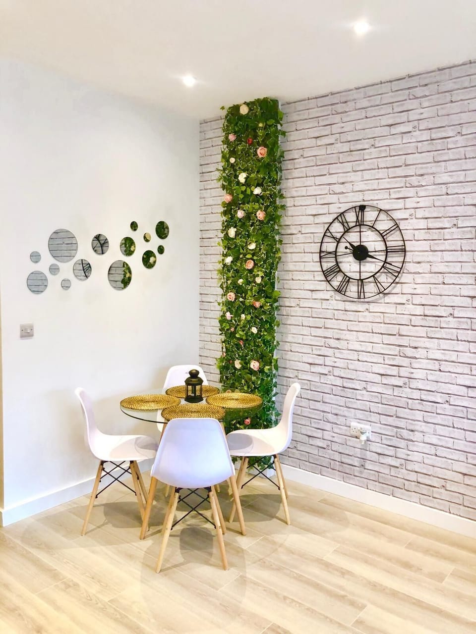 Dining room with feature flower wall. 