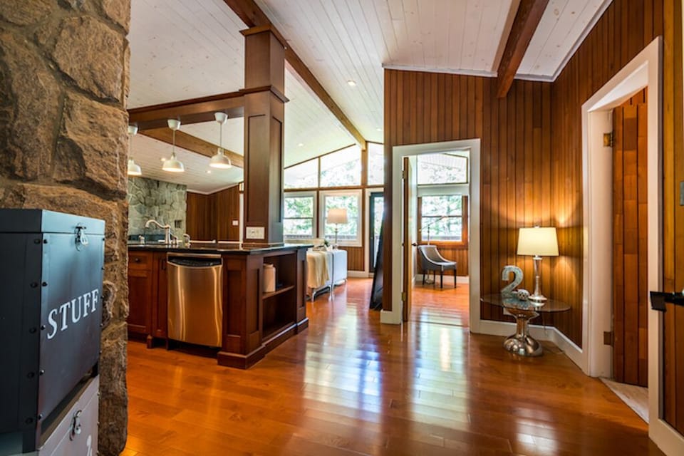Large open concept great room w/ vaulted ceilings and views of the lake!