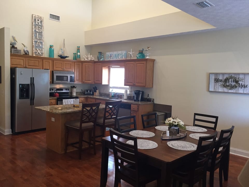 Kitchen with breakfast bar and dining table - seating for 11 people