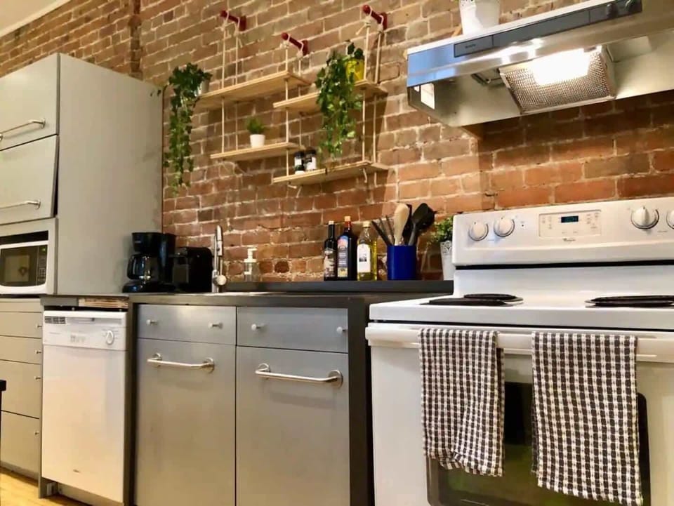 Fully equipped modern kitchen with high-end appliances.