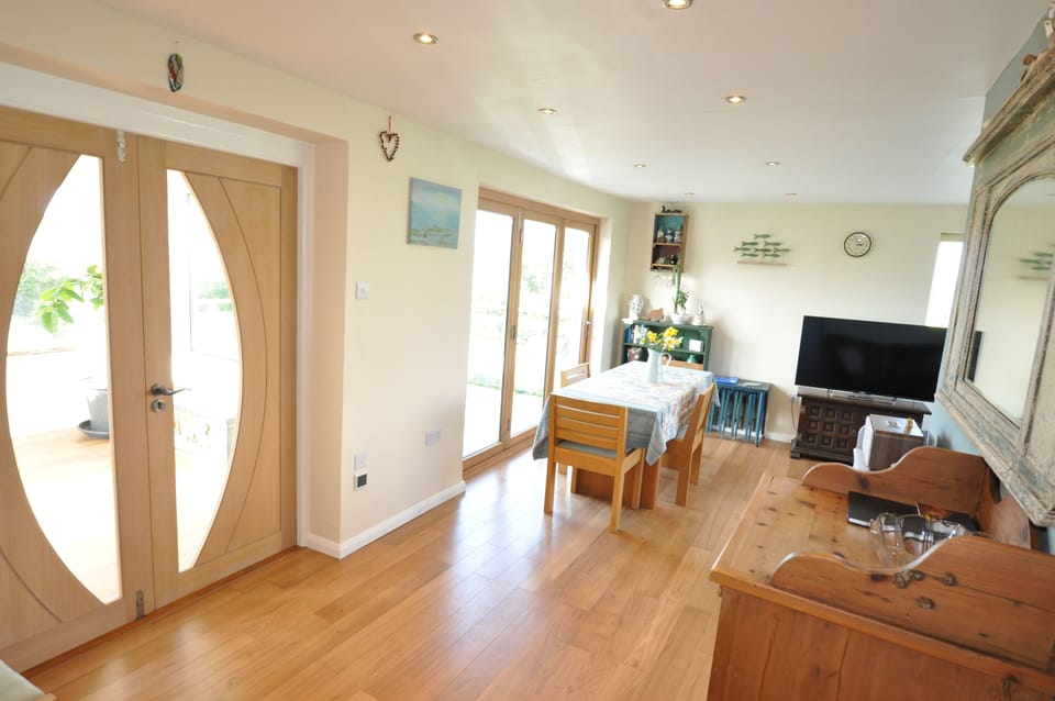 Trifold doors to Sun terrace and double doors to sun room.