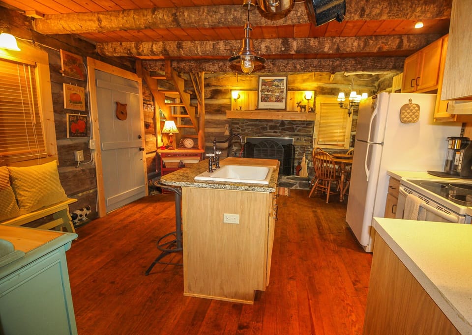 Enjoy the stone fireplace with gas logs while you prepare a delicious meal.