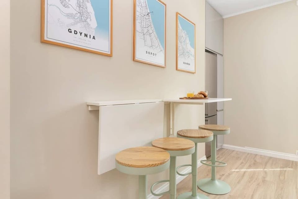 The kitchen's bar table with four stools is perfect for casual dining.