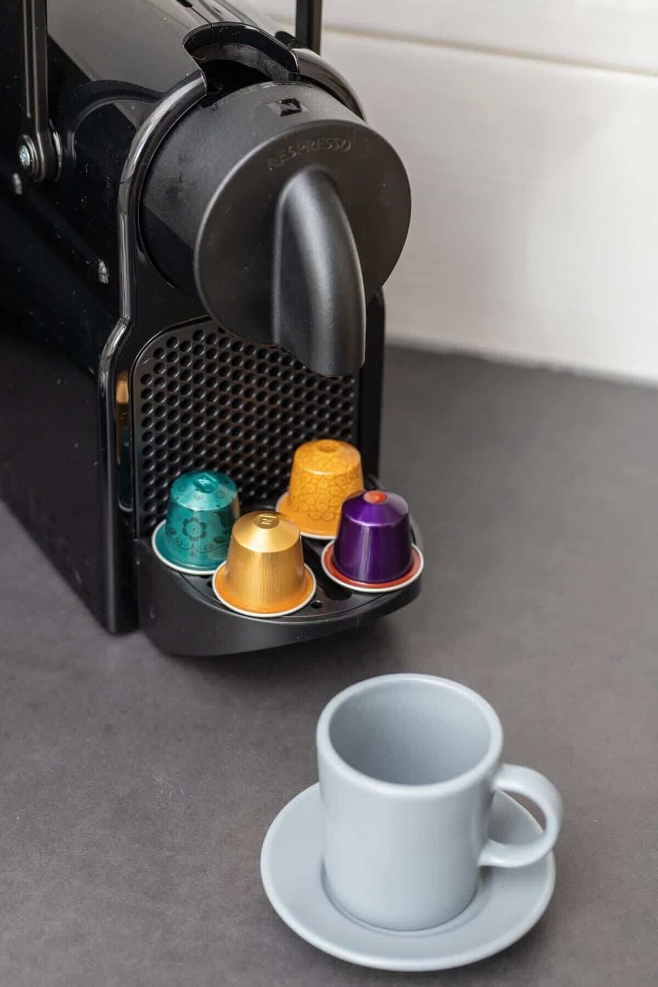 Enjoy a fresh cup of coffee from the capsule coffee maker in the well-appointed kitchen.