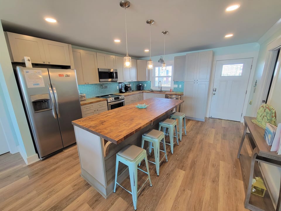 Fully updated kitchen.  8 ft. center island with under counter wine and beverage center.