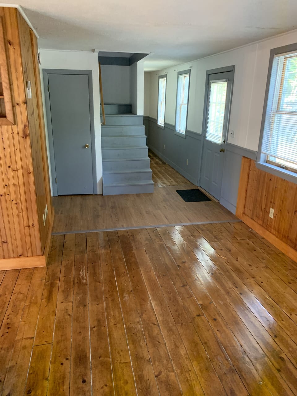 Hallway, newly varnished floors & stairs going to the 2nd floor.