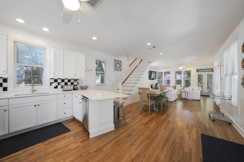 KITCHEN VIEW TO DINING AREA AND LIVING AREA