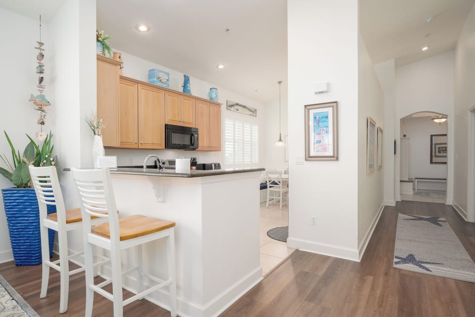 Kitchen is large and opens up to the dining area with seating at the counter.
