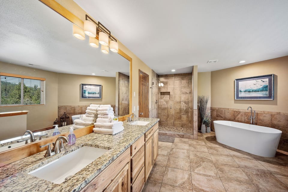 Unwind in your luxurious master bath with soaking tub, walk-in shower, and granite counters—pure spa-like indulgence awaits.