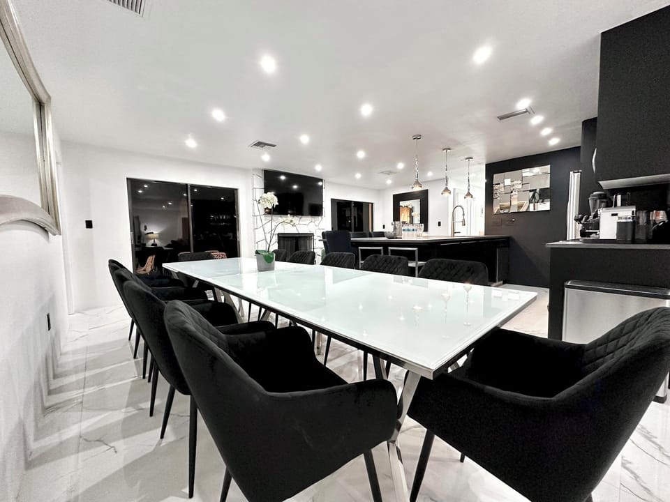 Gather around the cozy dining table, perfect for family meals or late-night conversations.