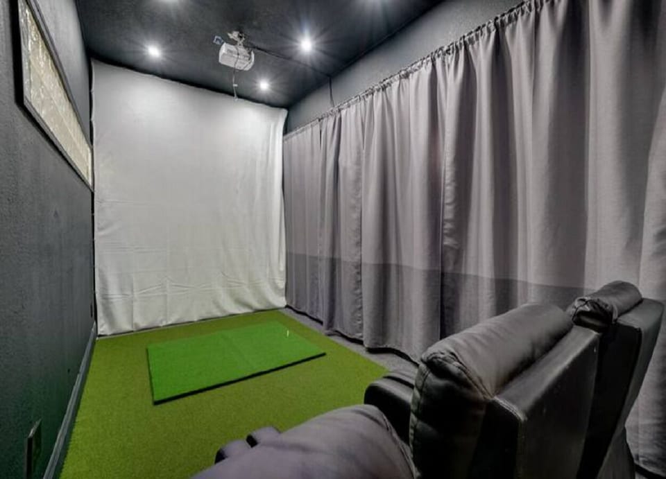 Home has a combined Golf Studio, Game & Movie room with some comfortable movie bean bag chairs to watch your favorite movie or game.