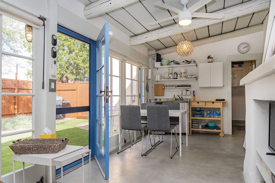 Screen door to yard space allows for flow of fresh air