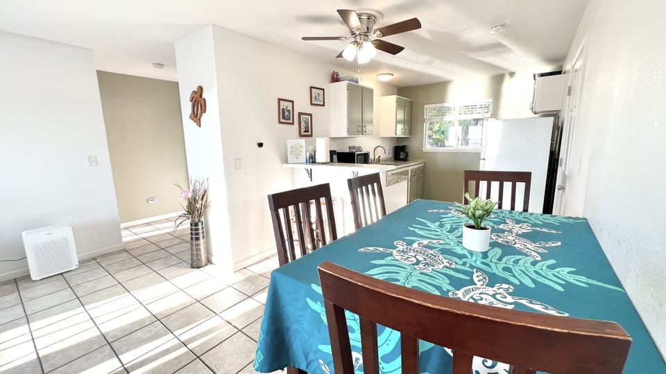 Dinning table with 4 chairs and two bar chairs to seat comfortably 6 people