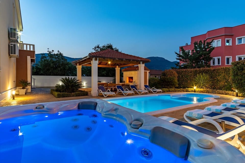 a jacuzzi near the pool and sun decks for perfect vacation