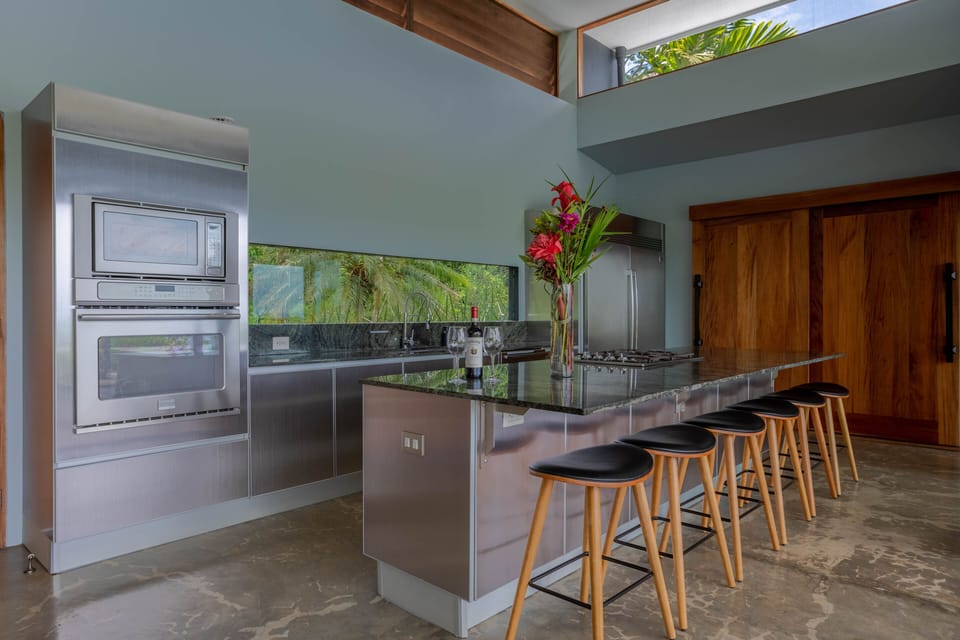 Fully stocked kitchen, with adjoining pantry and laundry room.
