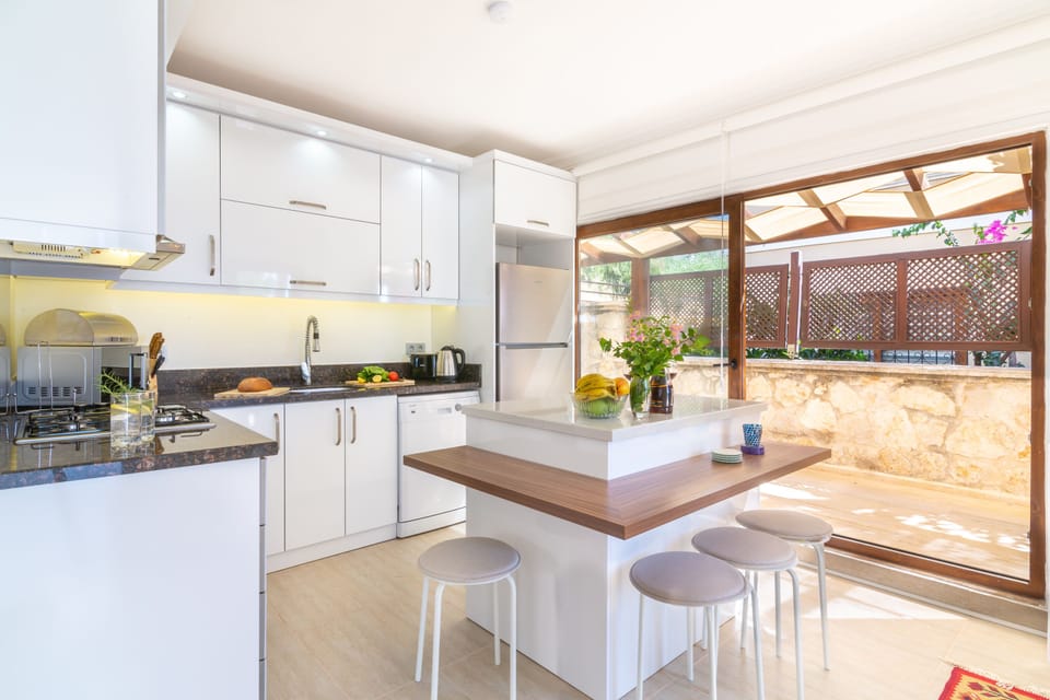 Open plan kitchen with sliding doors out onto the al fresco dining area