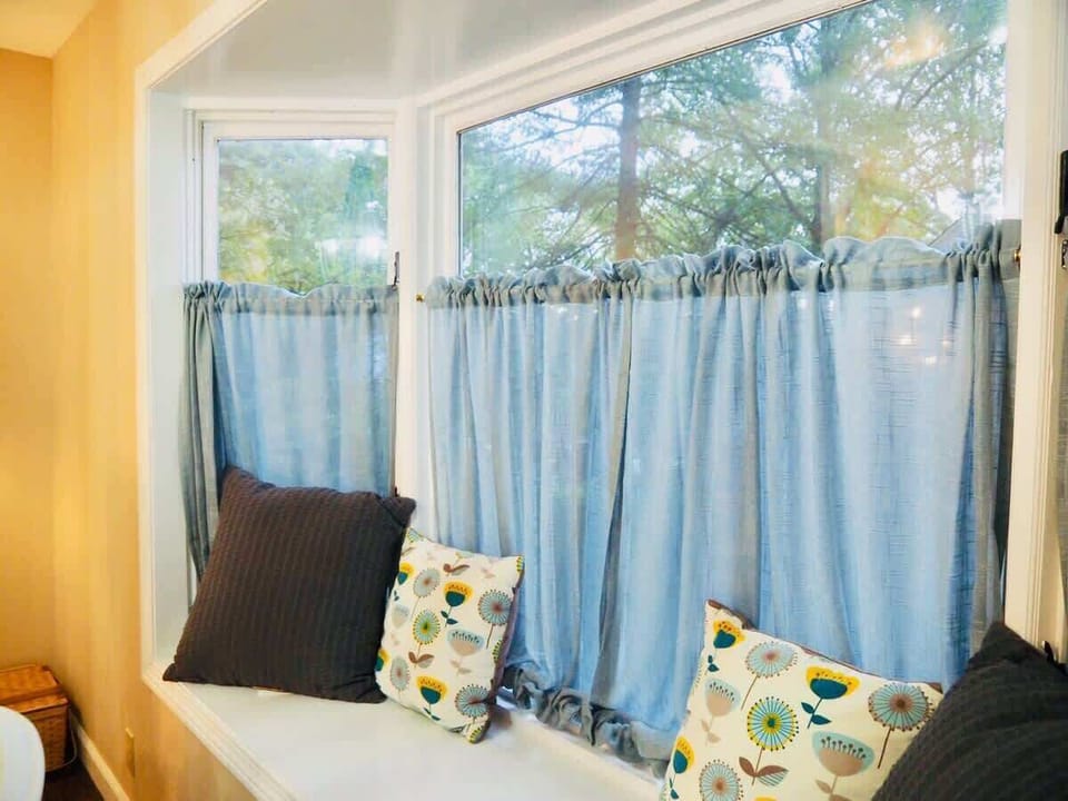  Charming bay windows lighten the interior and let in natural light.