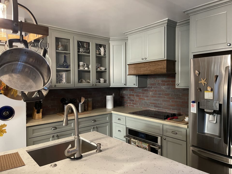Kitchen includes smart fridge, glass stovetop, and convection oven/microwave