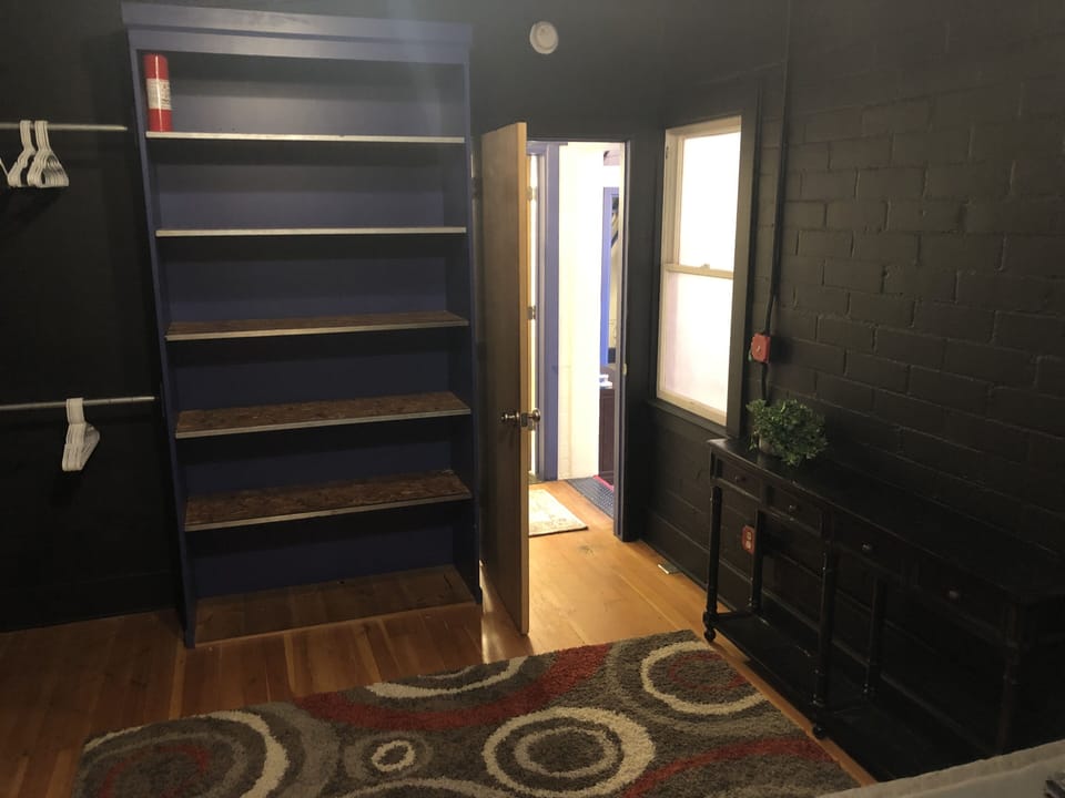 Bedroom #3 with 1 queen bed and built in shelving