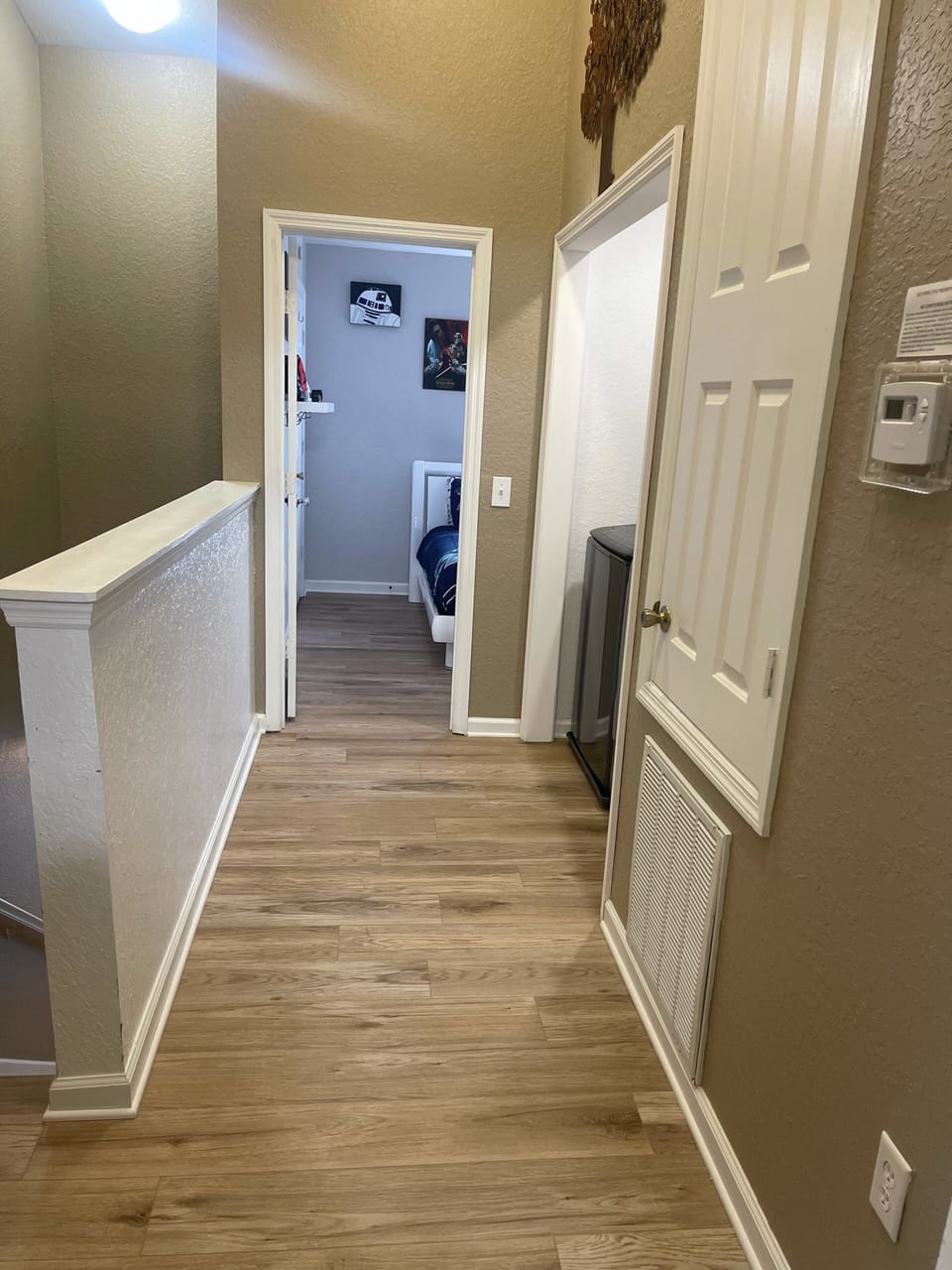 Upstairs hallway with second floor laundry.  New LVP.
