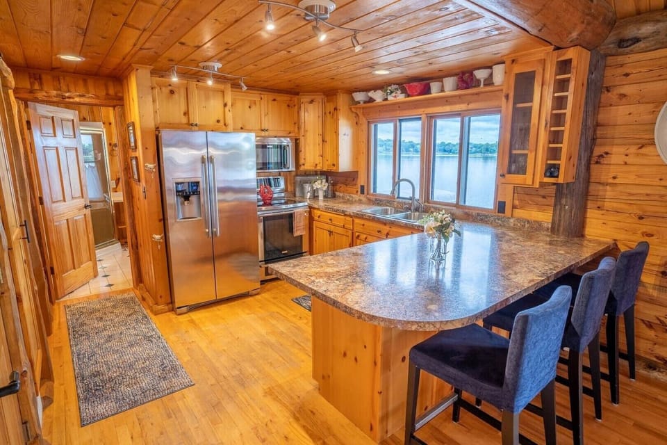 Main floor - SS appliances, oversized peninsula & window overlooking the lake.